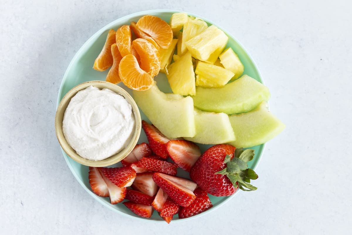 cottage cheese dip with fruit on plate.