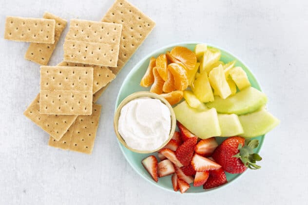 cottage cheese dip on plate with fruit and graham crackers