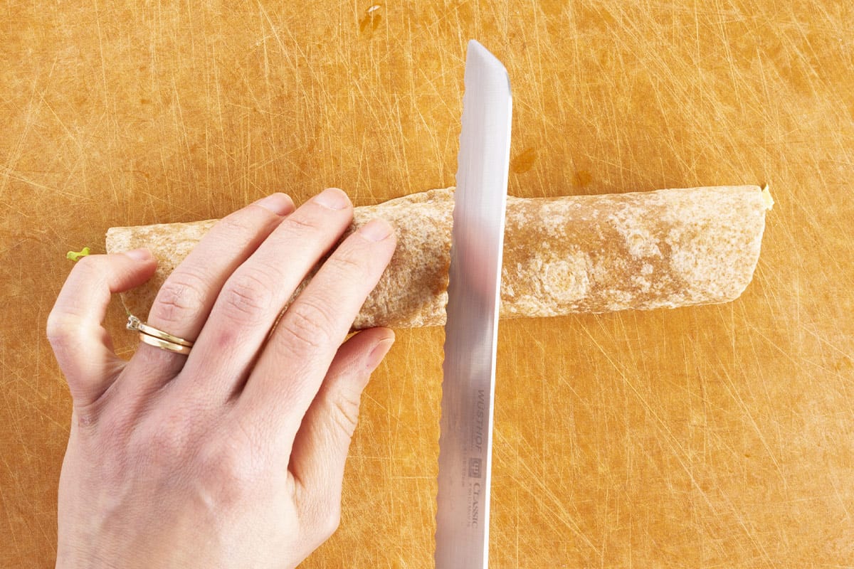 slicing turkey wrap with serrated knife