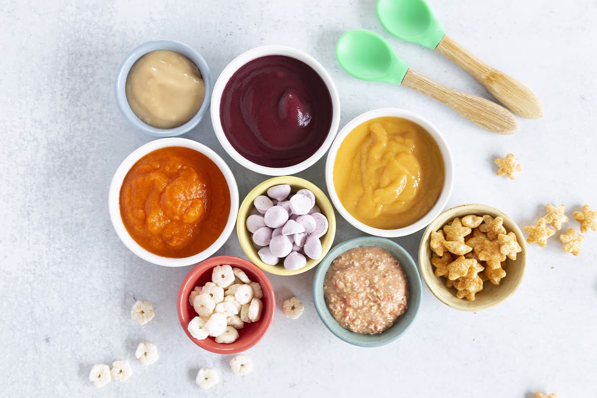 organic baby food on counter in bowls with spoons