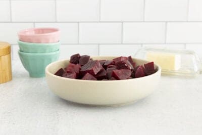 boiled beets in white bowl on countertop