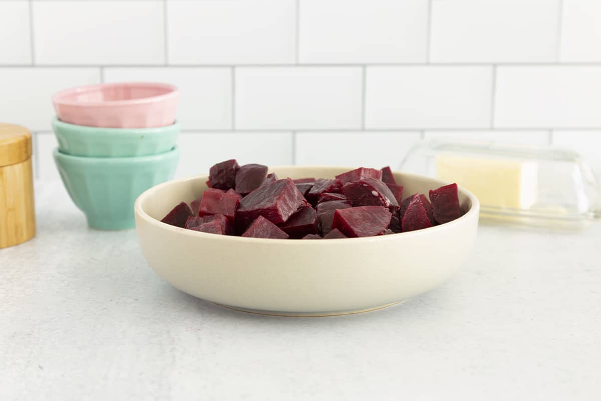 boiled beets in bowl on countertop.