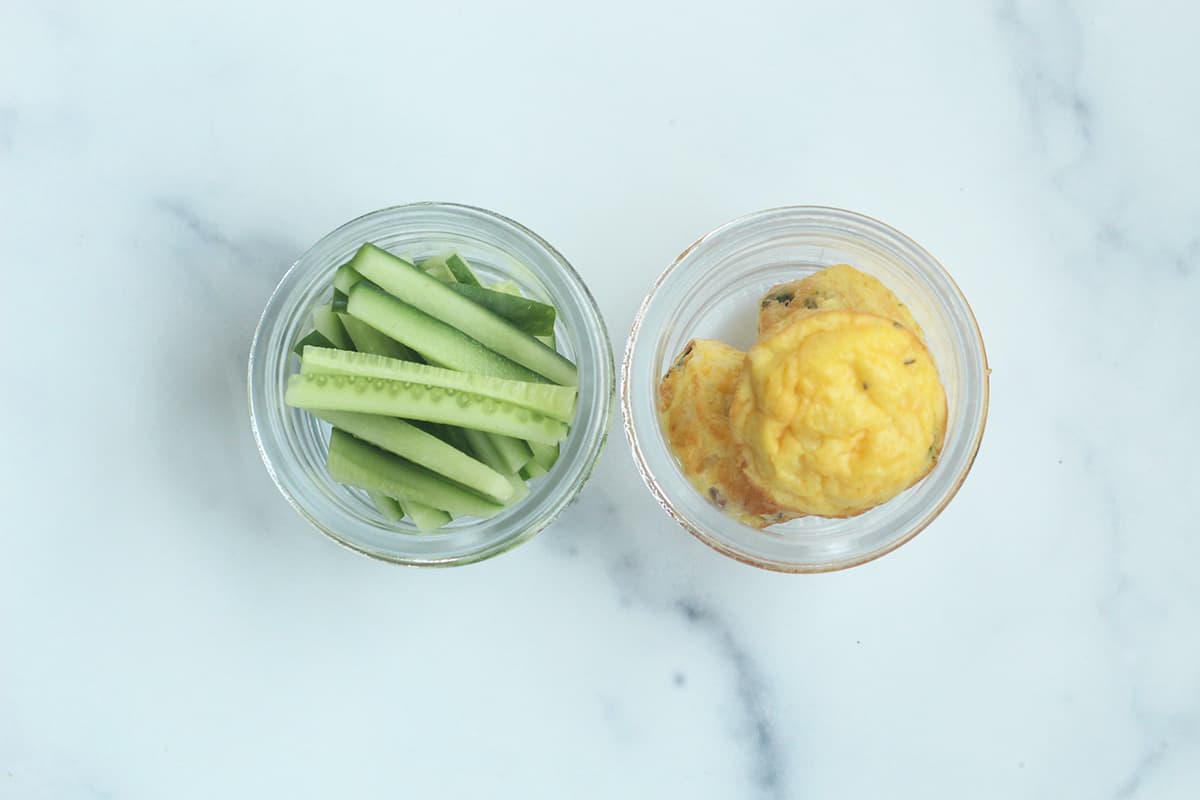 egg muffins and cucumber sticks in containers