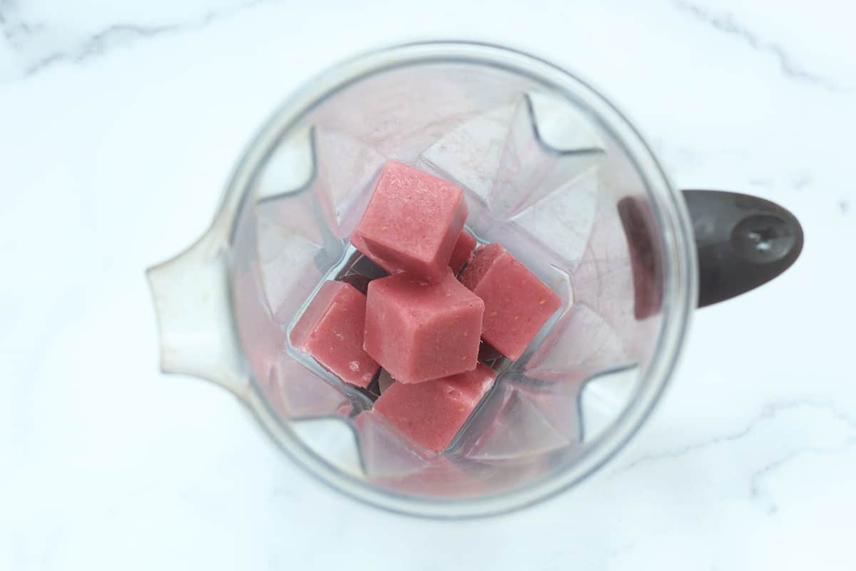 frozen cubes of smoothie in blender