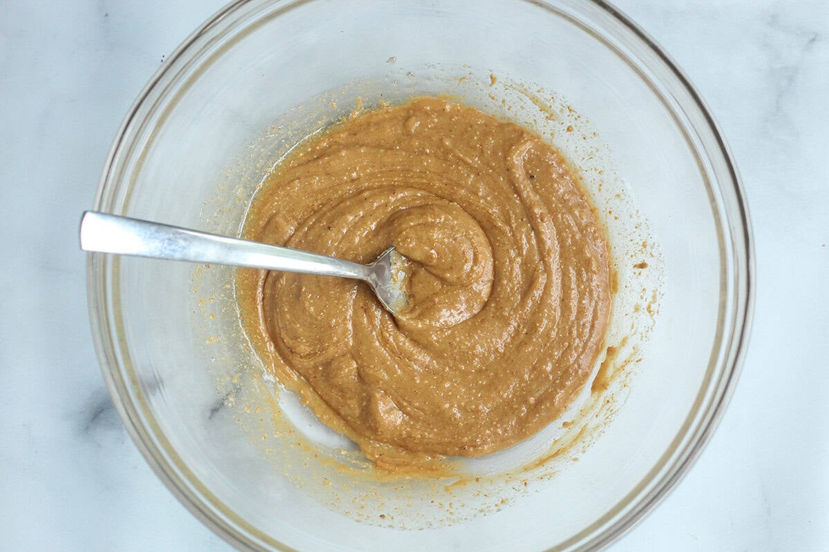 wet ingredients for cereal bars in bowl.