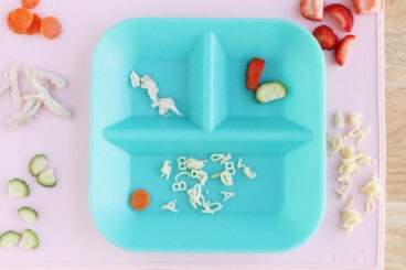toddler plate with food on pink placemat