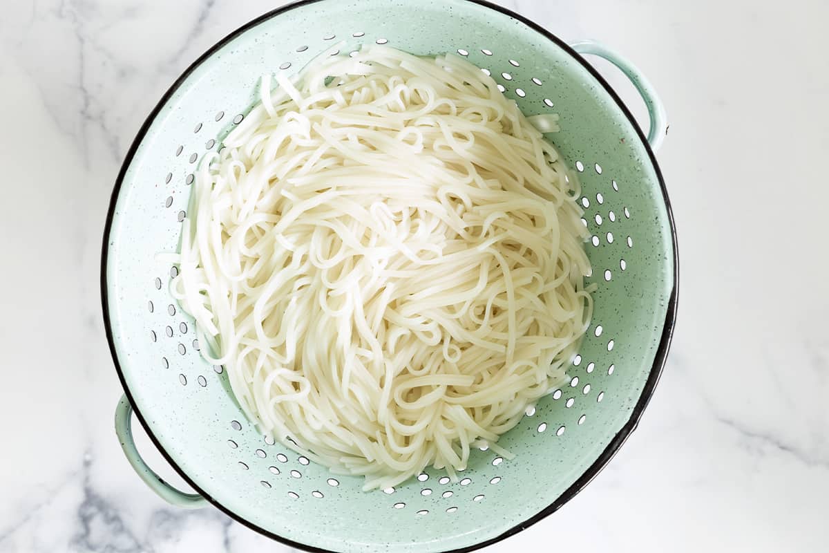 prepared rice noodles for stir fry noodles in colander