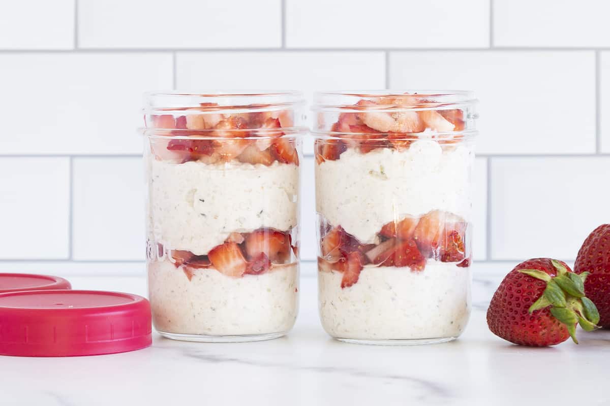 strawberry overnight oats in jars on counter