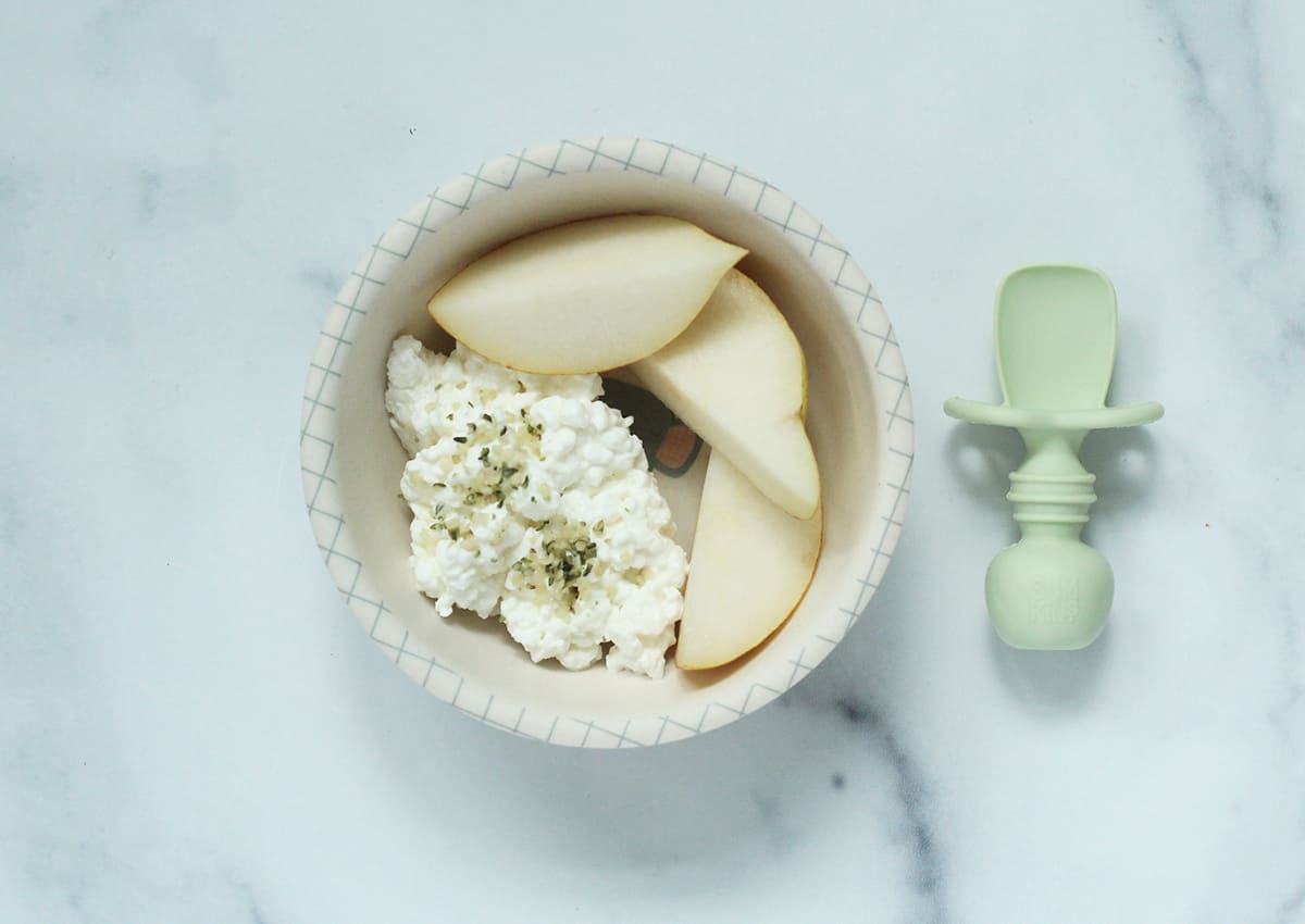 cottage cheese in baby bowl with pear slices