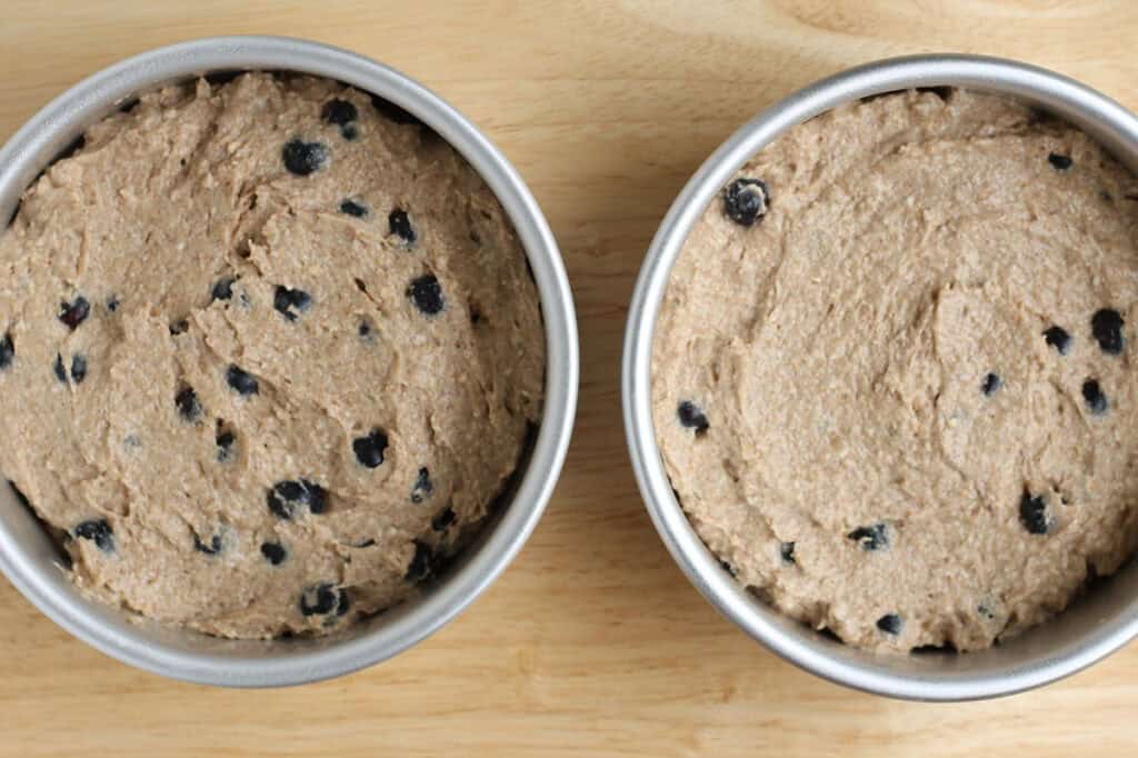 blueberry smash cake batter in pans.
