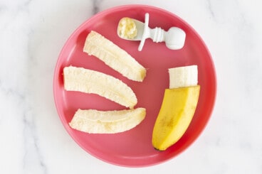 Banana in different forms on red plate for blw banana