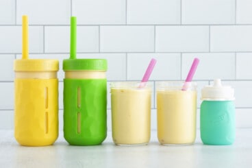 smoothie cups in row on countertop.