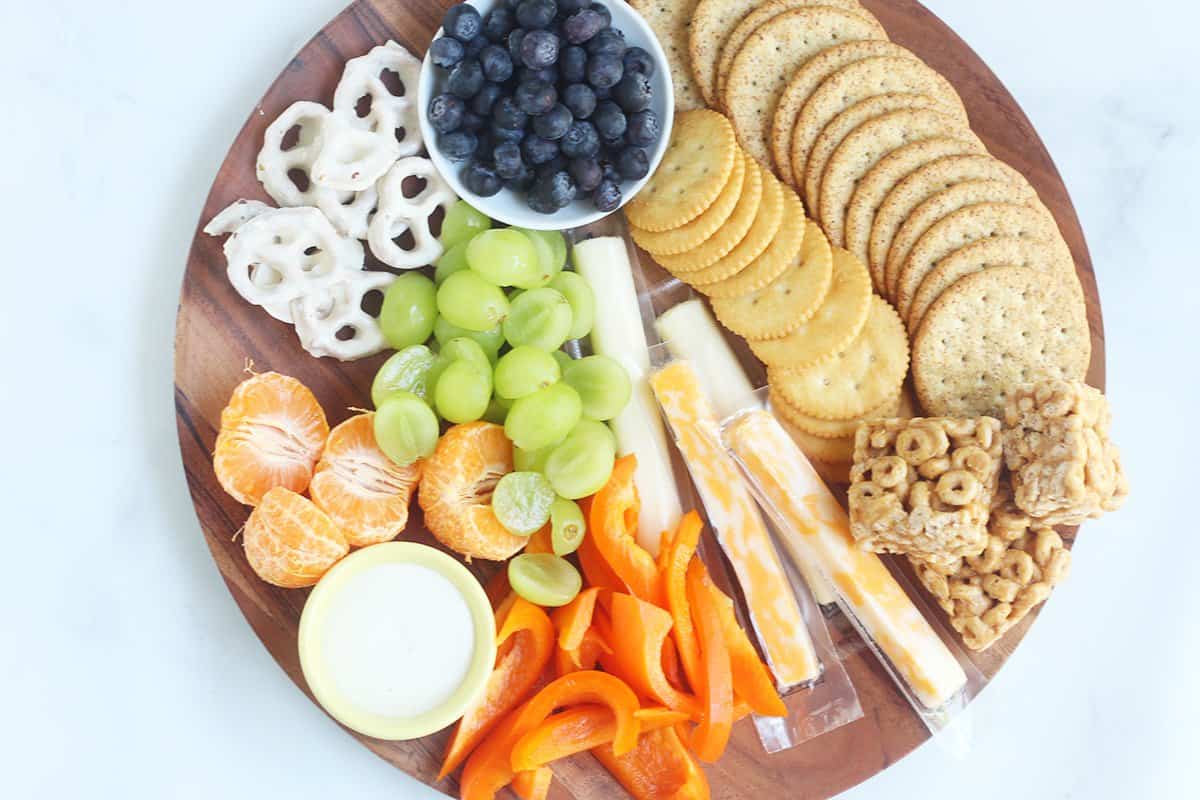 round easy healthy snack plate with assorted foods.