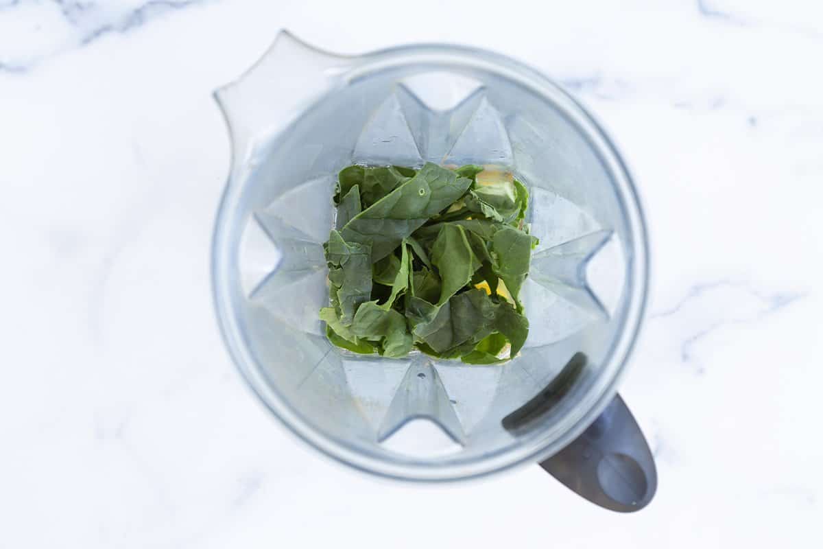 Spinach and eggs in a blender.