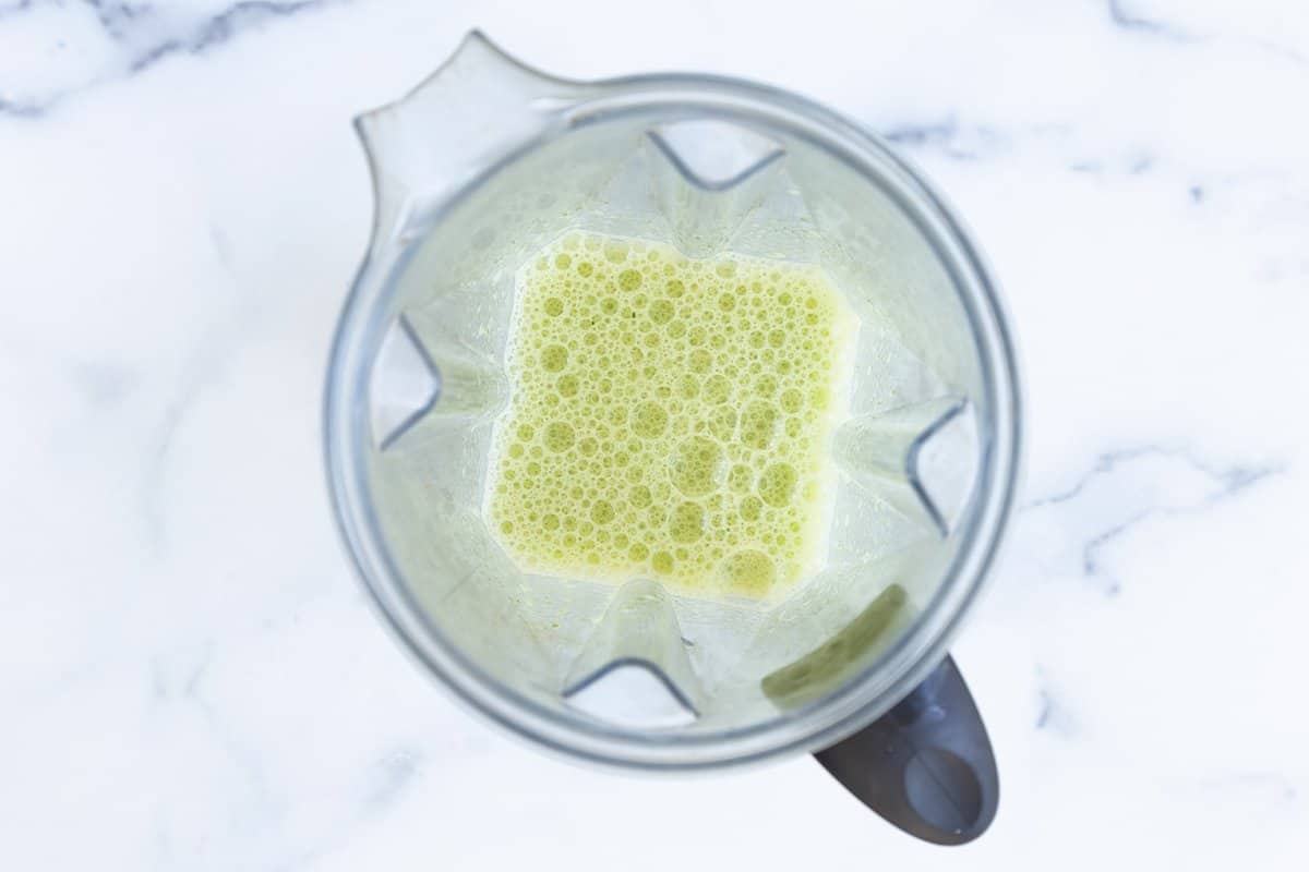 Blended spinach and eggs in a blender.