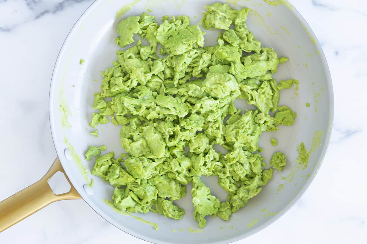 Cooked spinach eggs in a pan.