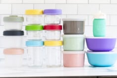 All different baby food storage containers all stacked on countertop