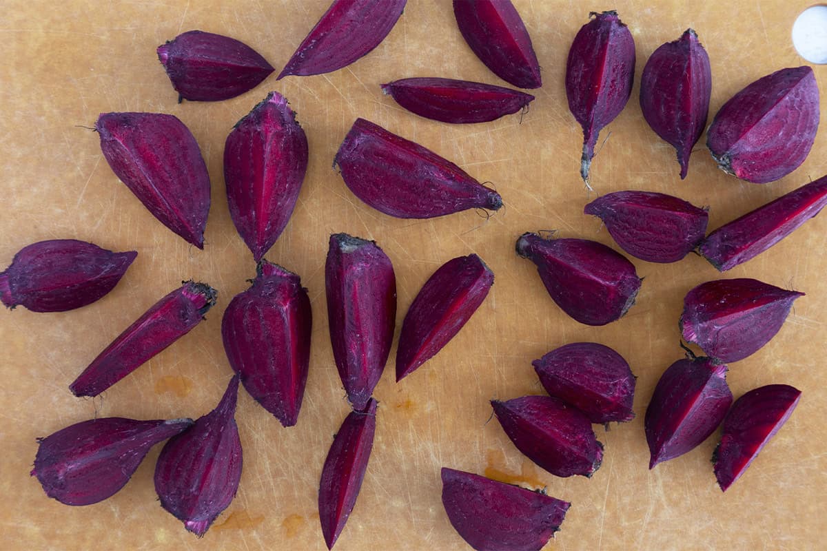 Beets on cutting board for boiled beets. 