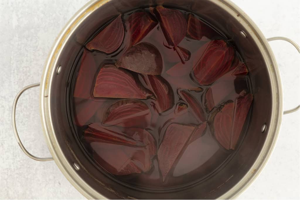 Beets in water in pot for boiled beets.