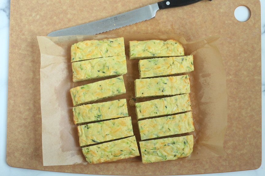 zucchini slice cut into rectangles on parchment paper