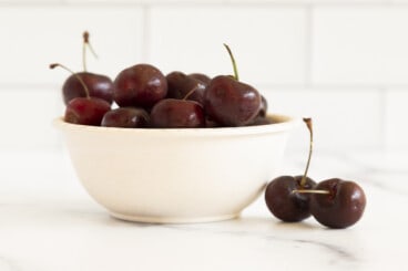 cherries in a bowl on counter