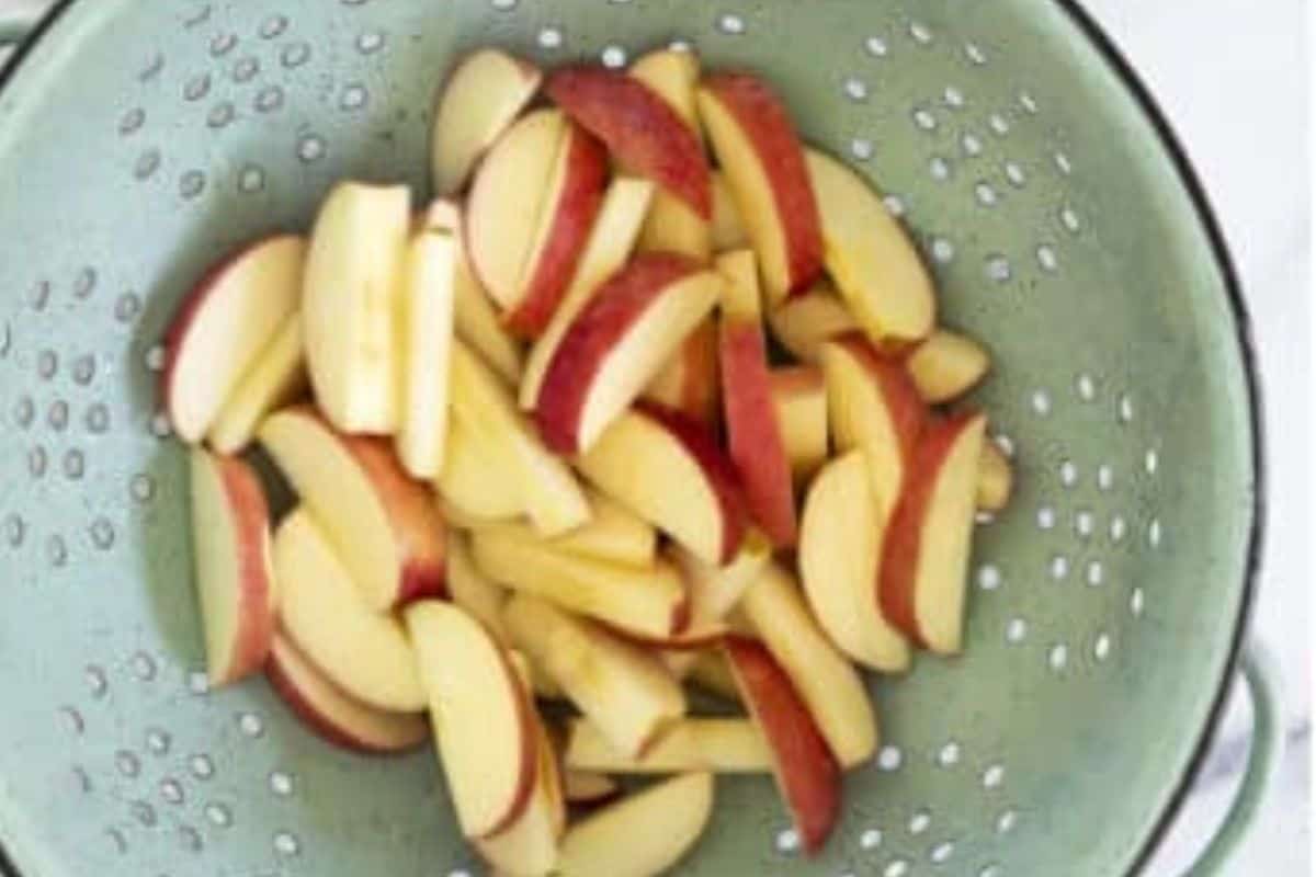 Apple slices in strainer.