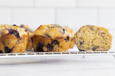 blueberry yogurt muffins on cooling rack from side