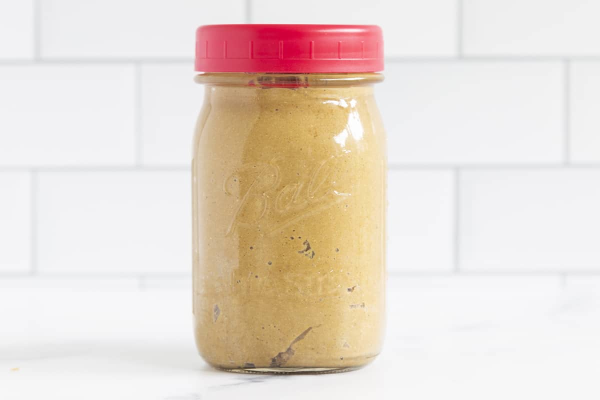 Sunflower seed butter in ball jar with lid on countertop