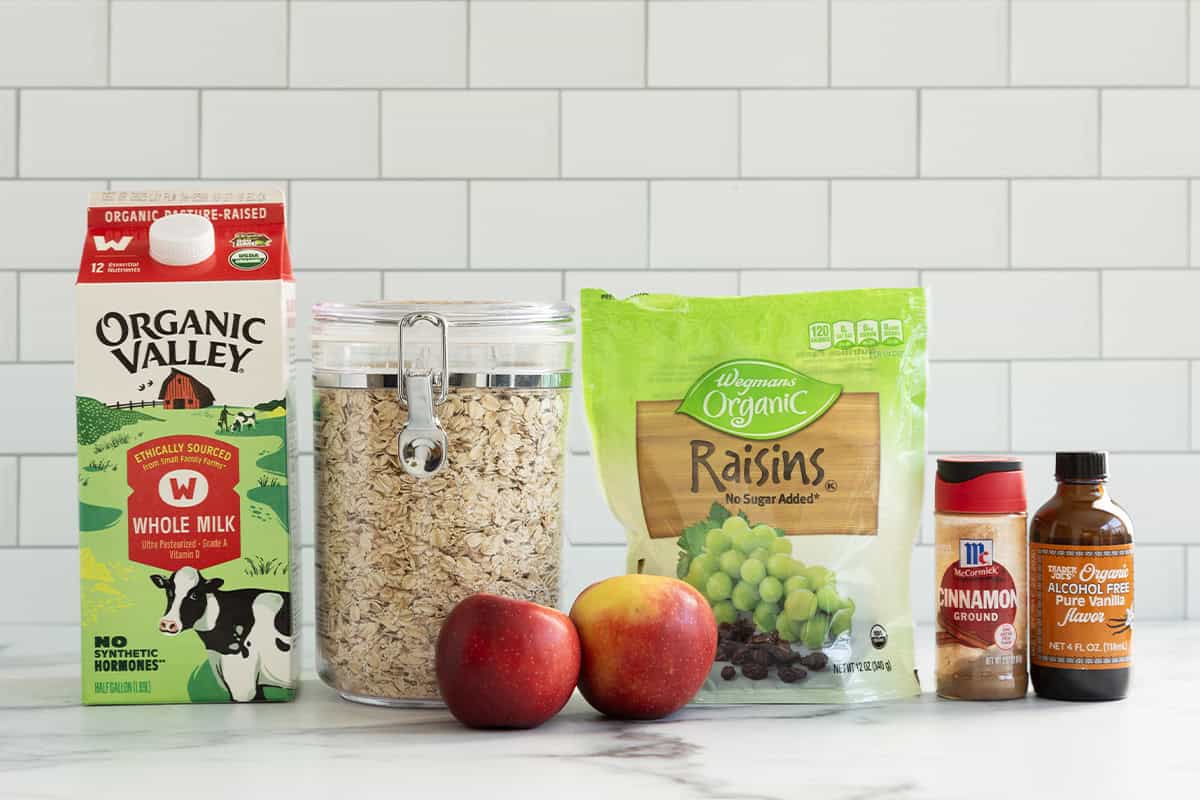 Ingredients for apple cinnamon oatmeal on countertop.