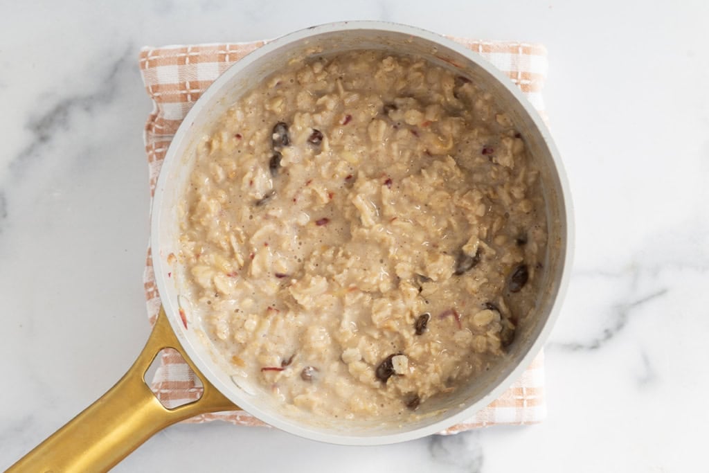 Apple cinnamon oatmeal in pot.