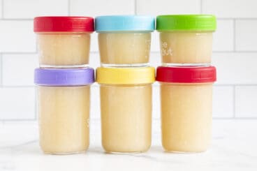 homemade applesauce in containers on counter.