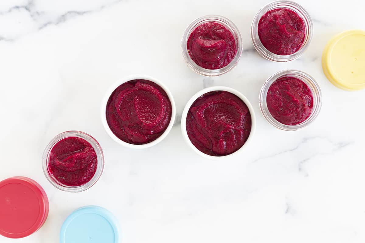 beets baby food in various containers with lids.