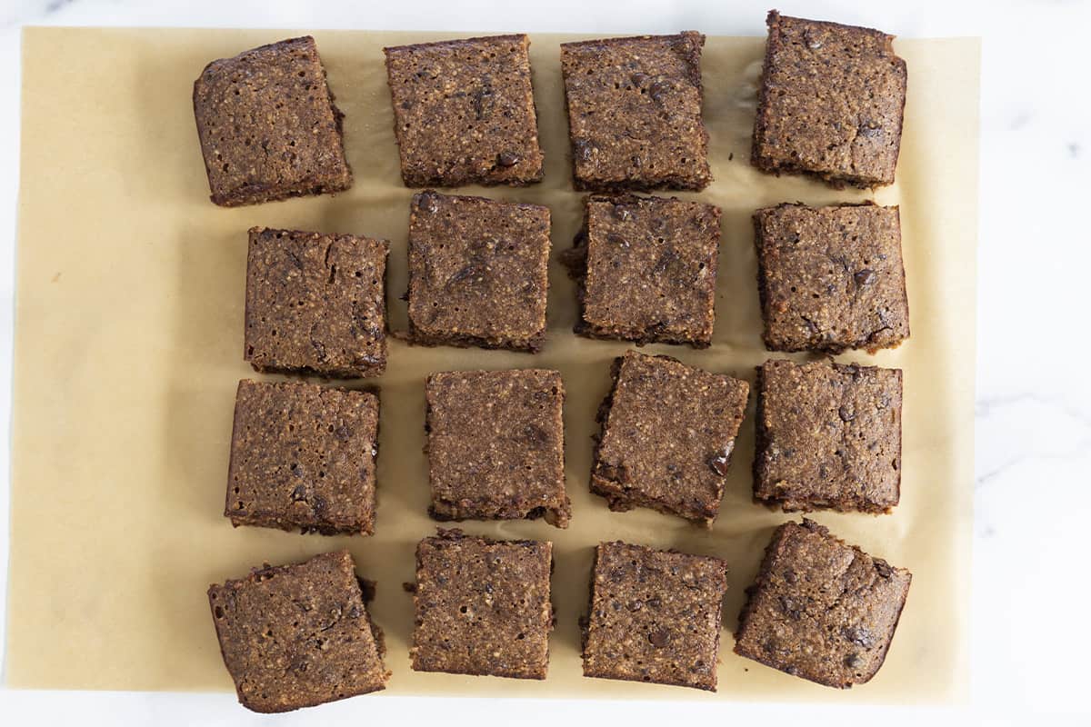 sliced brownies on parchment paper.