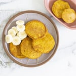 pumpkin pancakes on plate with banana slices