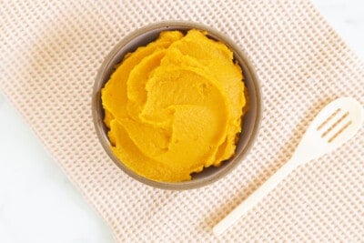 sweet potato puree in bowl with spoon on side