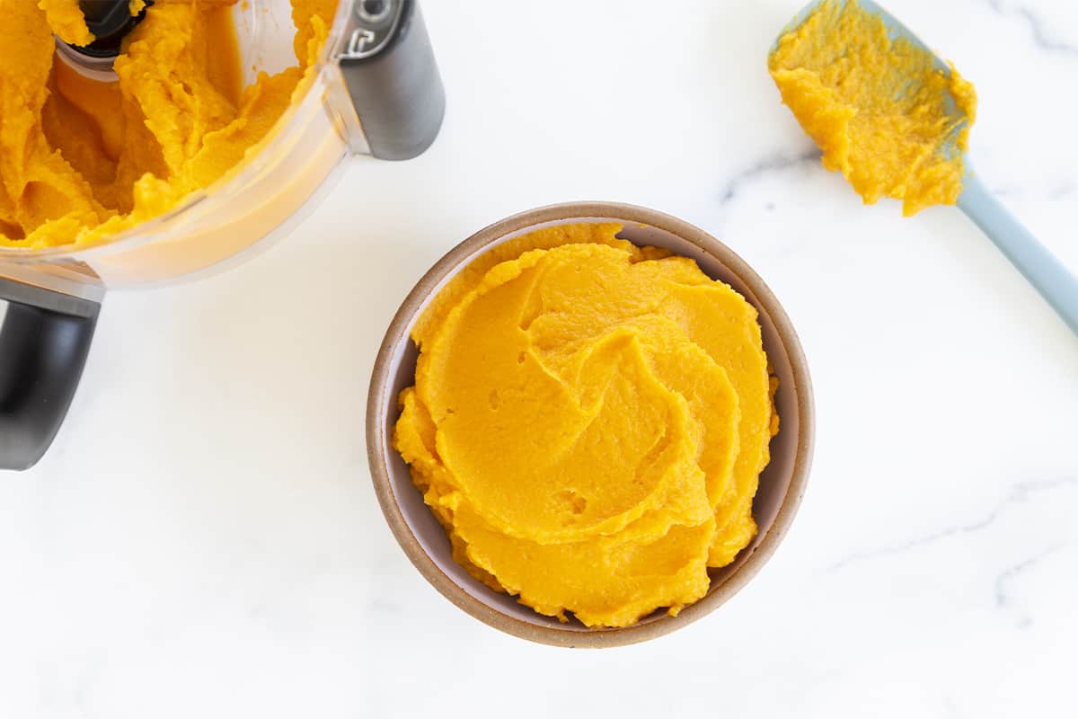 sweet potato puree in bowl with spoon on side