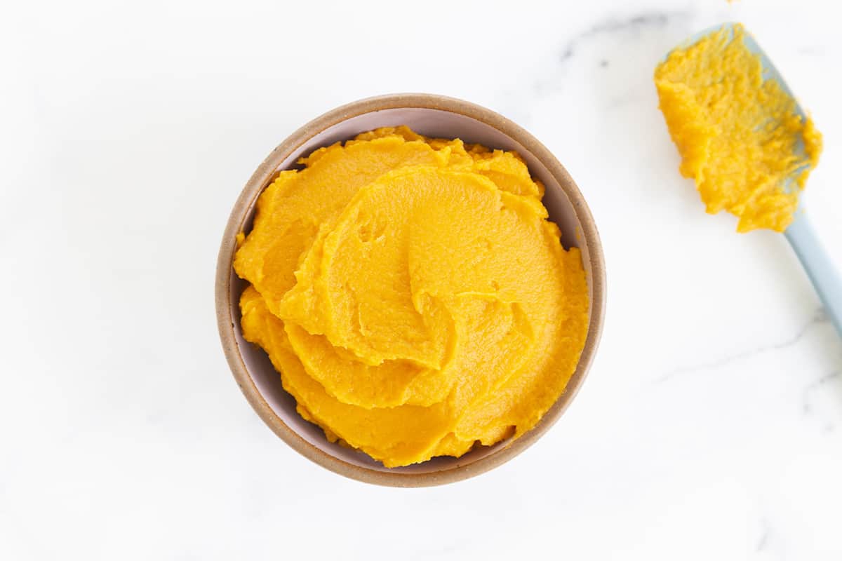 sweet potato puree in bowl with spoon on side