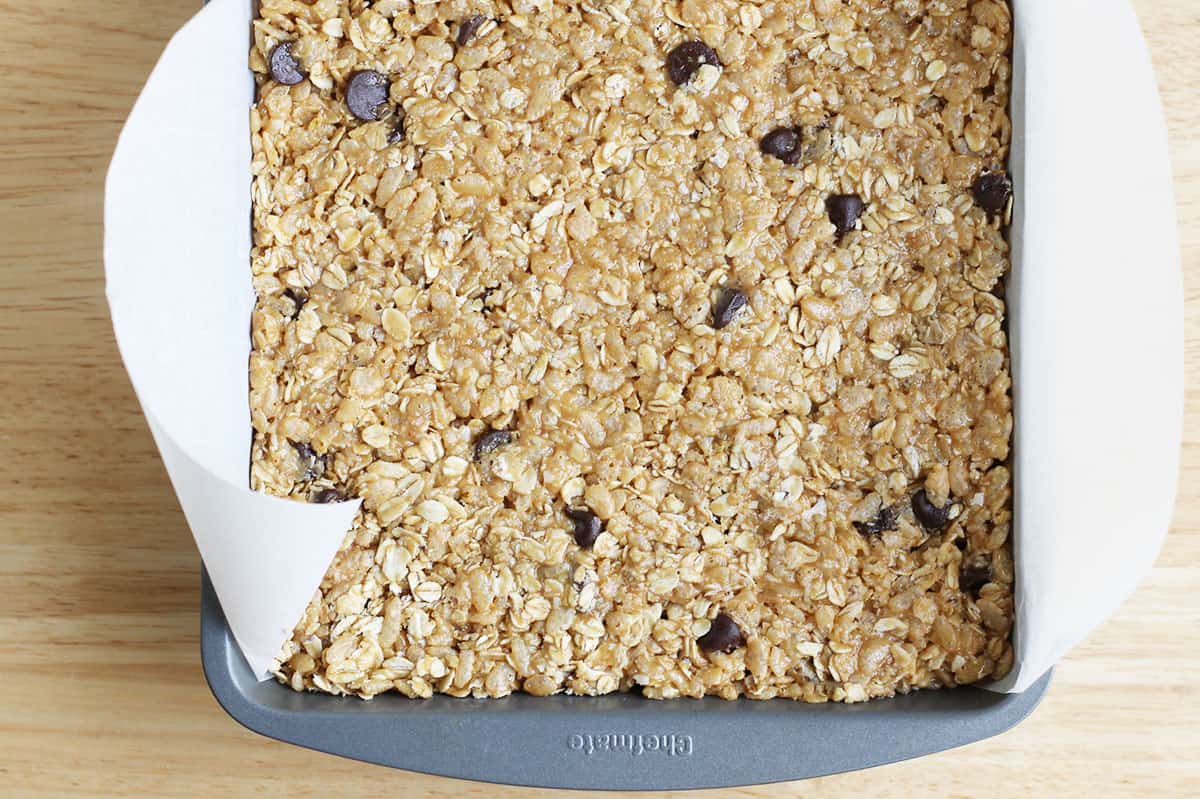 no bake granola bars in pan with parchment paper.