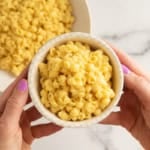 Butternut squash mac and cheese in white bowl.