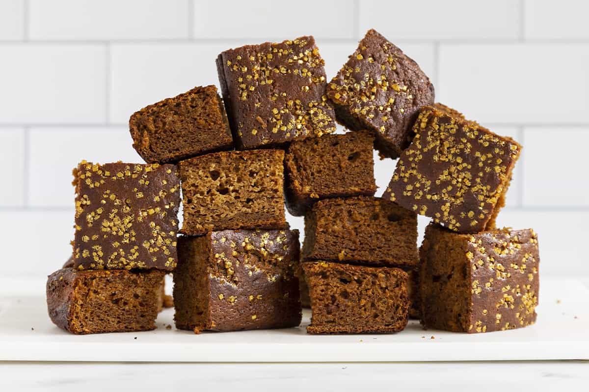Stacked squares of gingerbread cake.