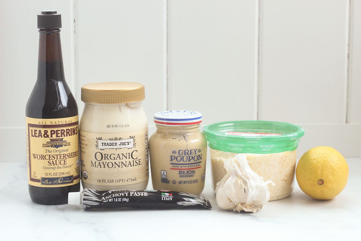 ingredients for homemade Caesar dressing on counter.