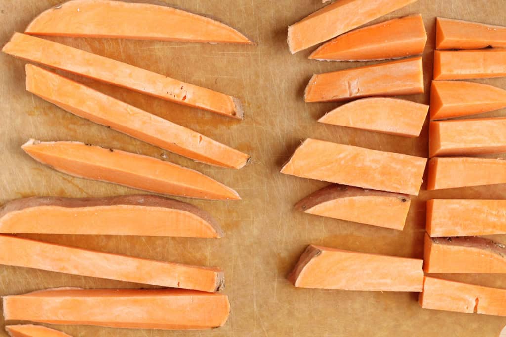 slices of cut sweet potato on cutting board.