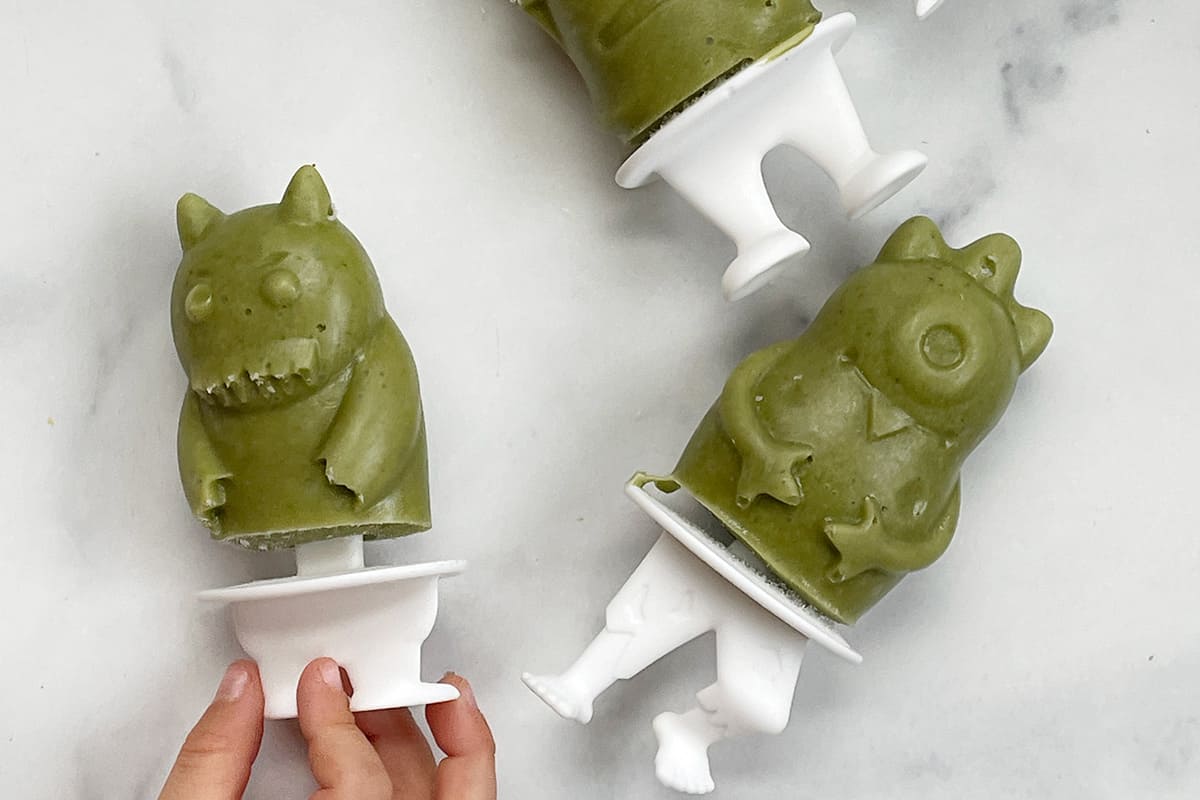 green smoothie popsicles in monster molds.