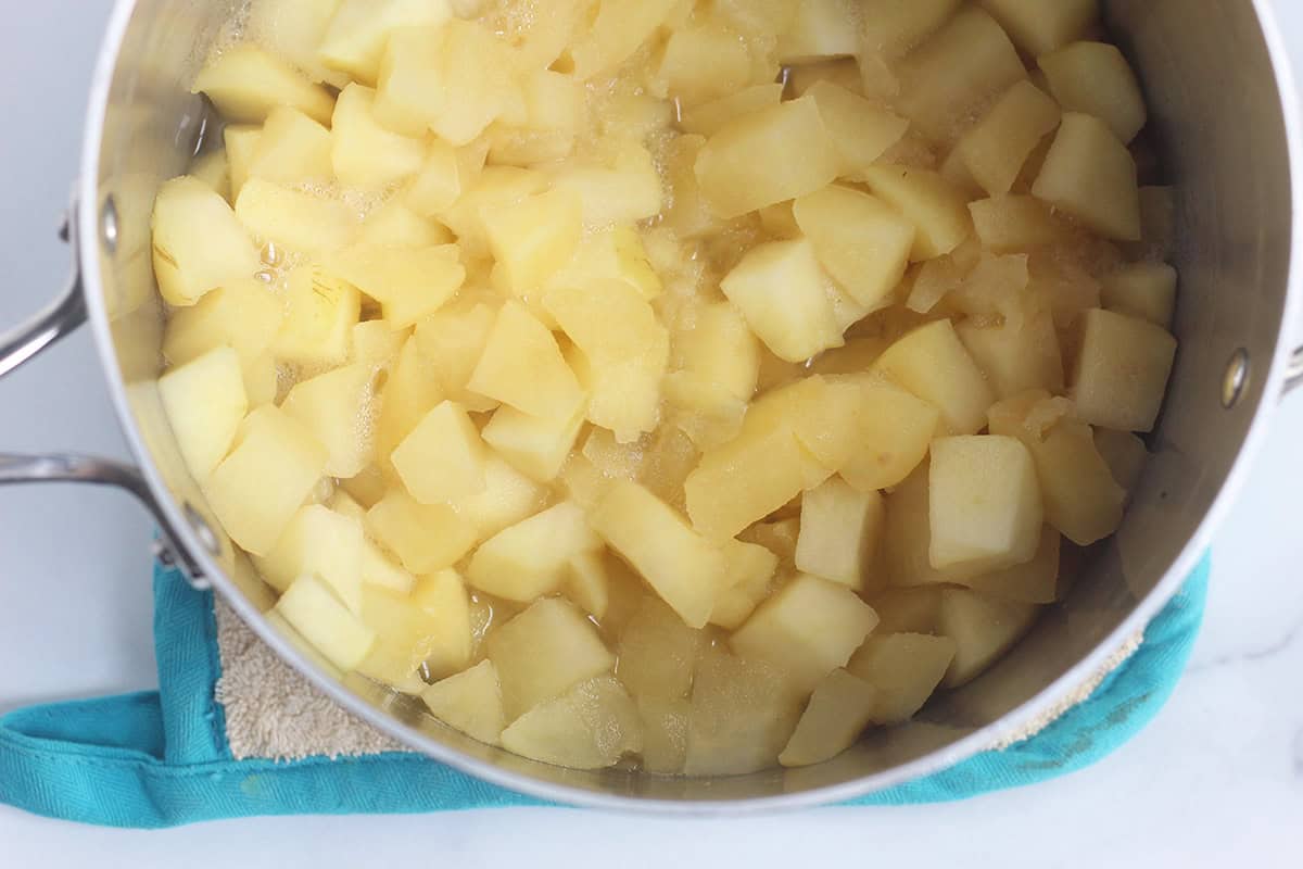 cooked stewed apples in pot.