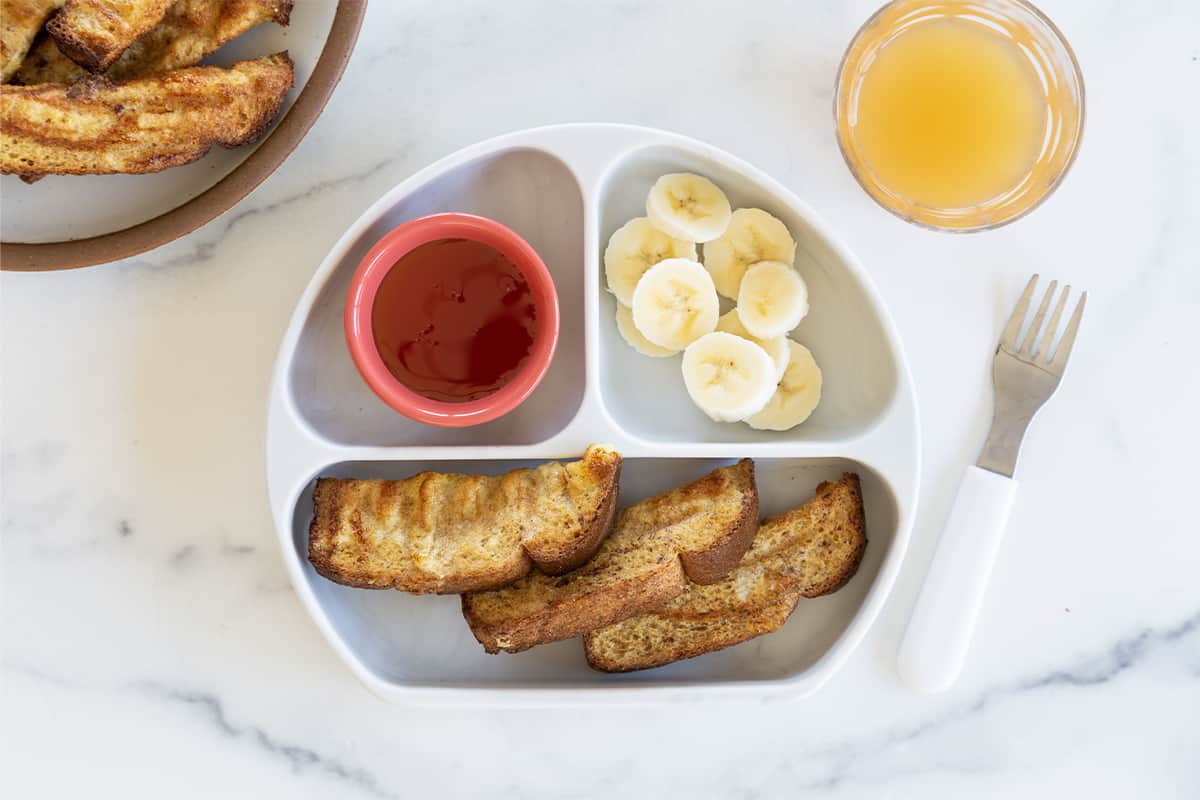 Air Fryer French Toast on child's plate with sides.