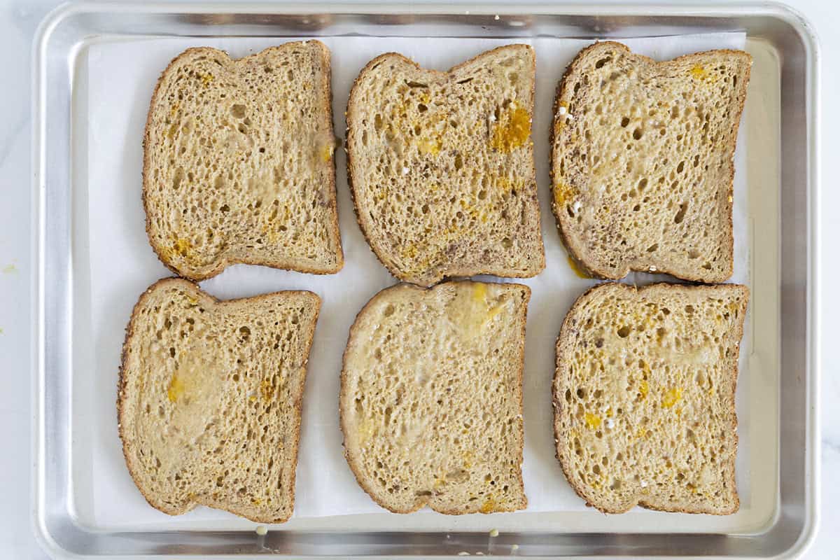 French toast on sheet pan before baking in oven.