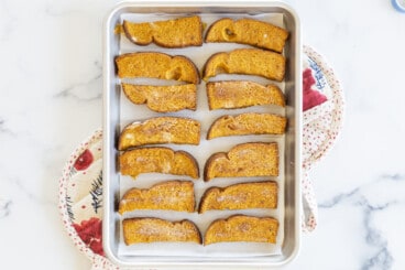 Pumpkin french toast sticks on baking pan.