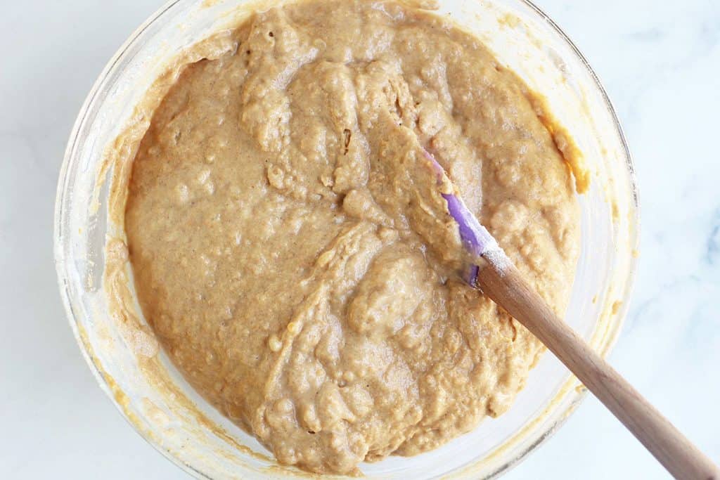 mixed wet and dry ingredients for sweet potato muffins in bowl.
