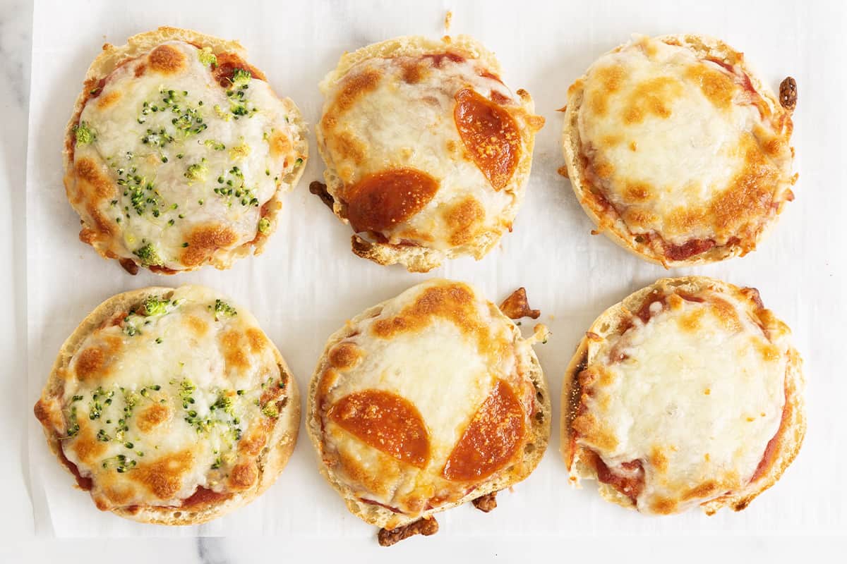 English muffin pizzas with different toppings.