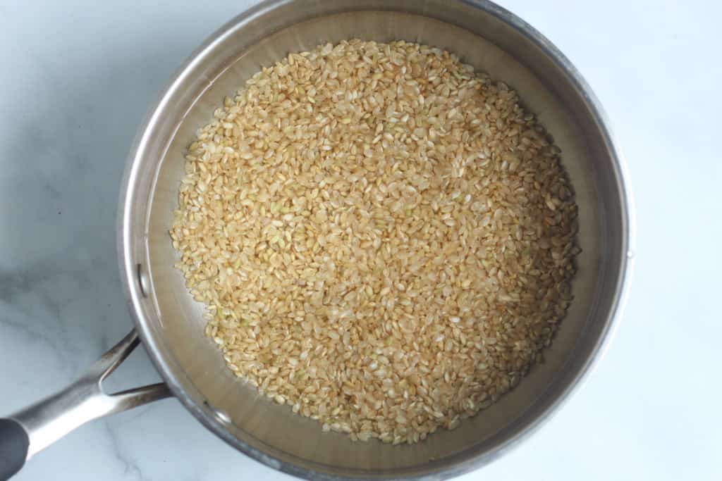 Baby rice cereal in pot with water.
